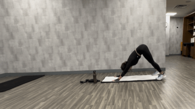 girl on mat doing yoga pose